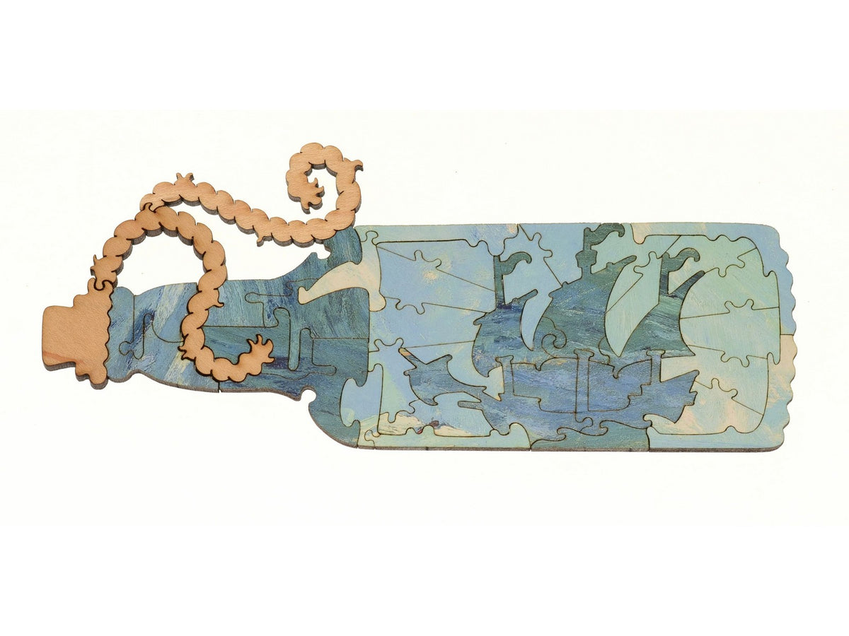 A closeup of pieces in the shape of a ship in a bottle.