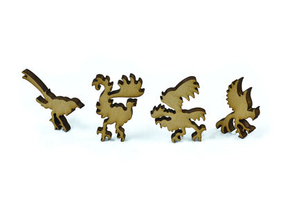 A closeup of pieces in the shape of birds.