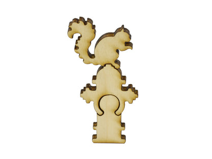 A closeup of pieces in the shape of a squirrel sitting on a fire hydrant.