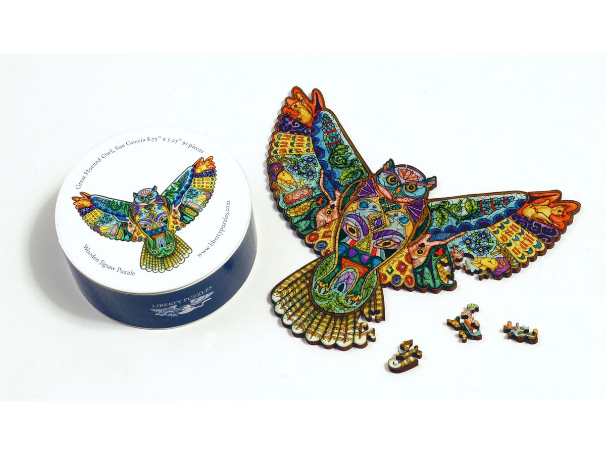 A closeup of the puzzle, Great Horned Owl Round, along with it's box.