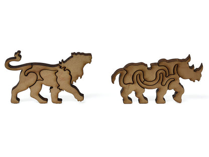 A closeup of pieces showing a lion and a rhinoceros.
