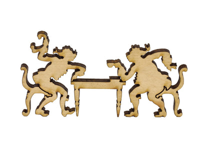 A closeup of pieces in the shape of two people drinking tea at a table.