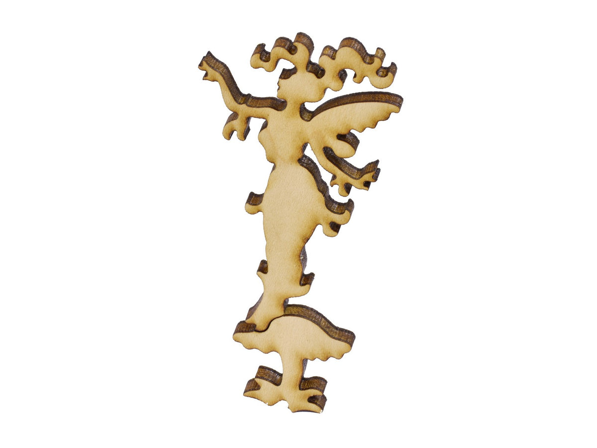 A closeup of pieces in the shape of a fairy.