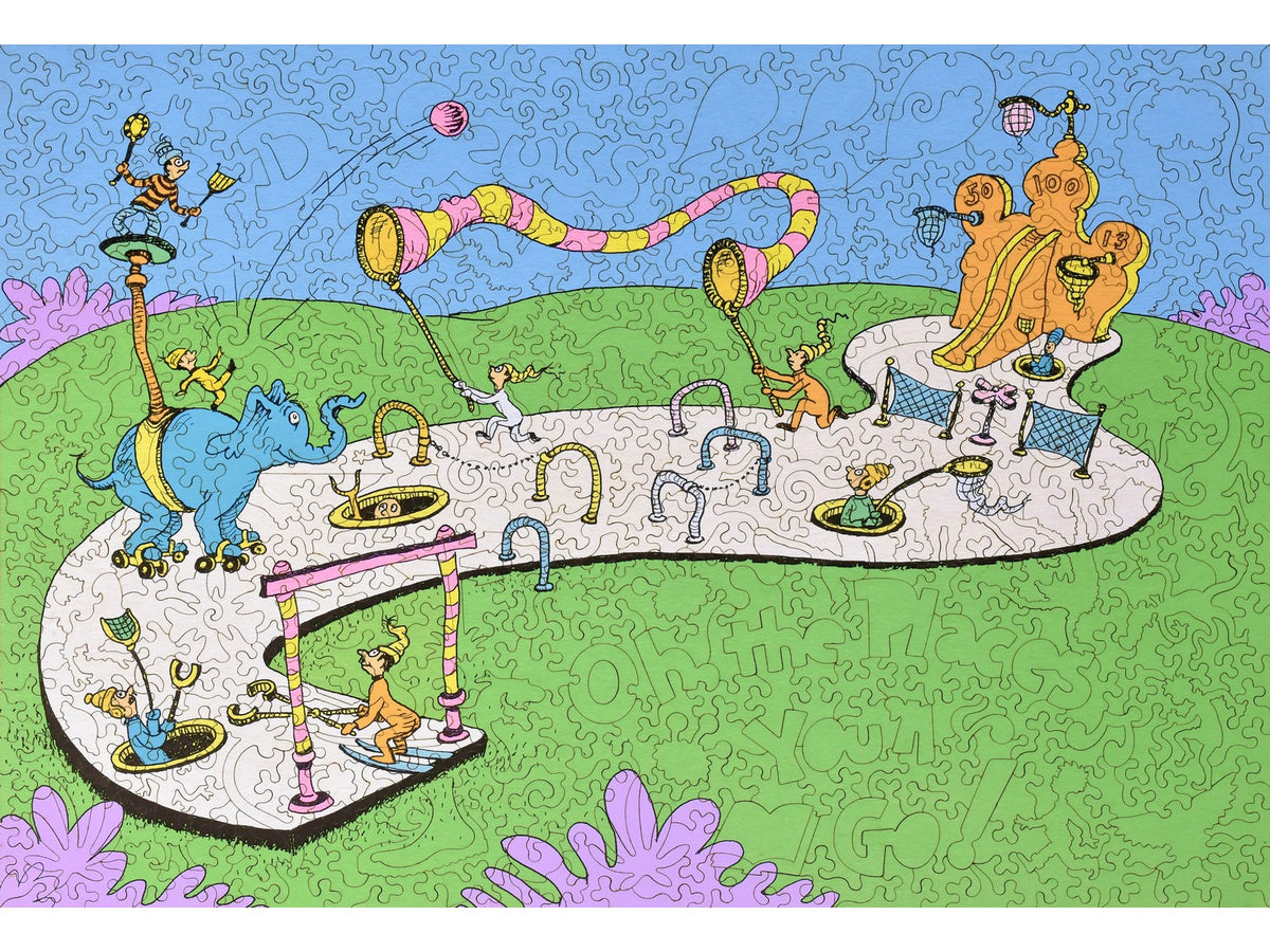 The front of the puzzle, Oh, the Places You'll Go, which shows a group of people playing a game.