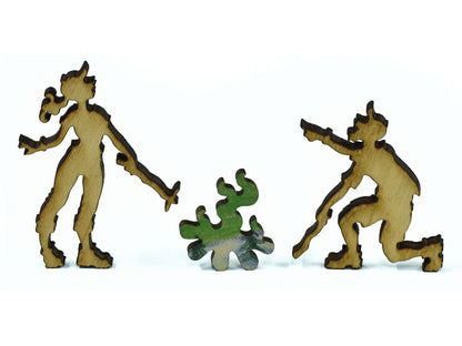 A closeup of pieces in the shape of two people around a campfire.