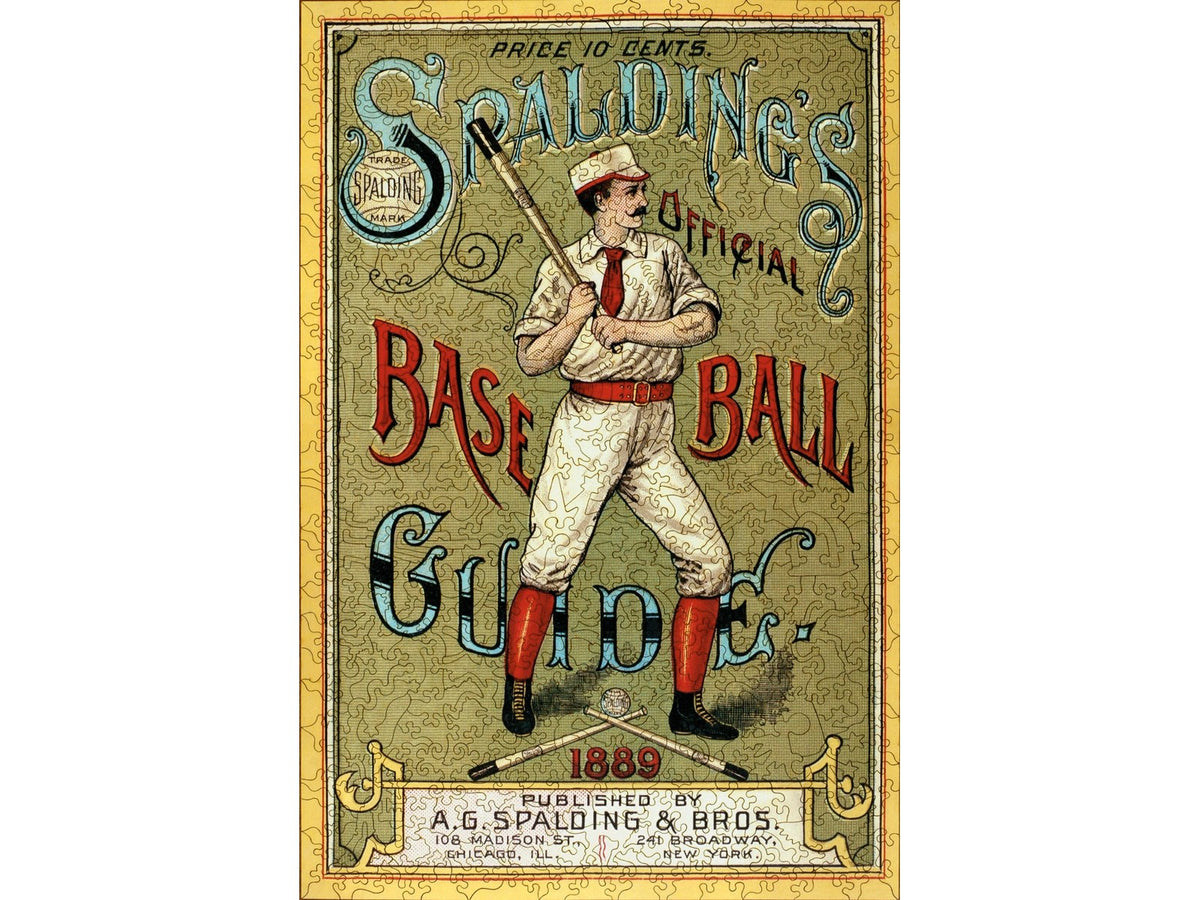 The front of the puzzle, Spalding's Baseball Guide, showing a man dressed in red and white and holding a baseball bat, surrounded by the puzzle title in decorative script.