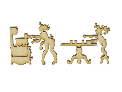 A closeup of pieces in the shape of two people in a kitchen.