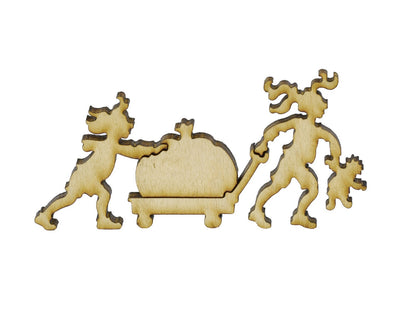 A closeup of pieces in the shape of children pulling a wagon with a pumpkin in it.