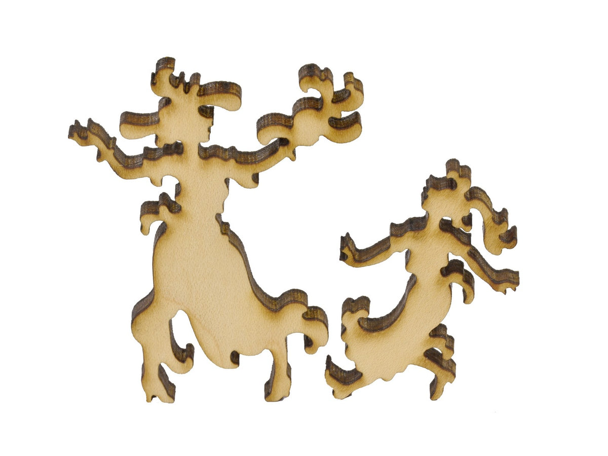 A closeup of pieces in the shape of a woman and a girl.