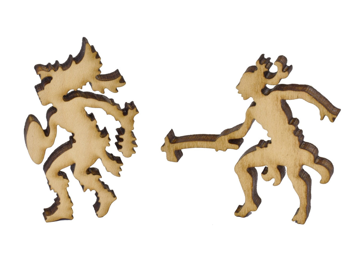 A closeup of pieces in the shape of two warriors.